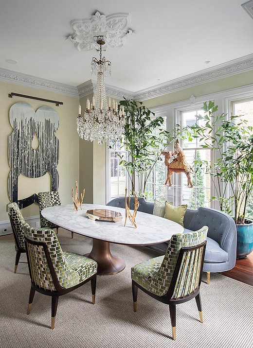 A breath of fresh light: A 19th-century French chandelier, Donghia chairs, and a custom sofa bring whimsy and elegance to the sunny dining room. Perched on a Lucite stand, a papier-mâché camel by Savannah artist Marcus Kenney is one of the homeowners’ many pieces commissioned to support and celebrate local artists.
